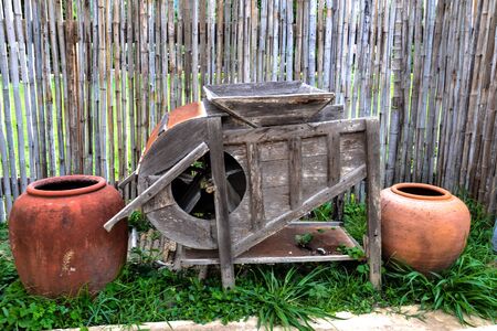 traditional rice rubbing machine for local farmer in thailandの写真素材