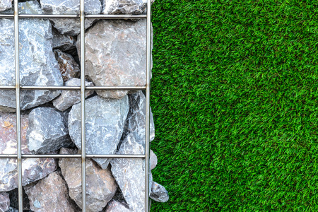 stone and grass wall in the gardenの写真素材