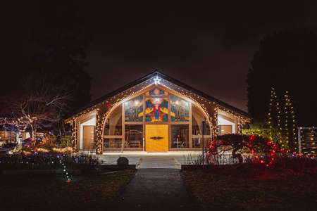 A low angle shot of a decorated christmas tree in the foregroundの写真素材