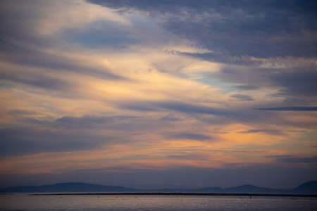Sunset over Lake Balaton, Hungary. Beautiful sky at sunset.の写真素材