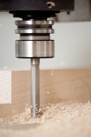 cutting wood with a CNC milling machinesの写真素材