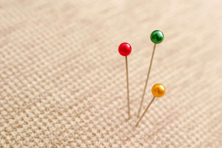 Three pins in the fabric.の写真素材