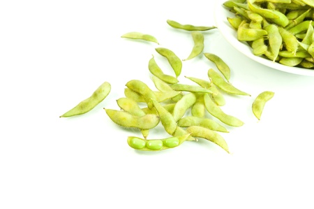 Fresh soybeans in a pod on white background 