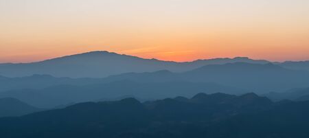 Panorama Beautiful sunset with layers of colors over the mountai