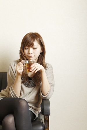 The woman who drinks tea の写真素材