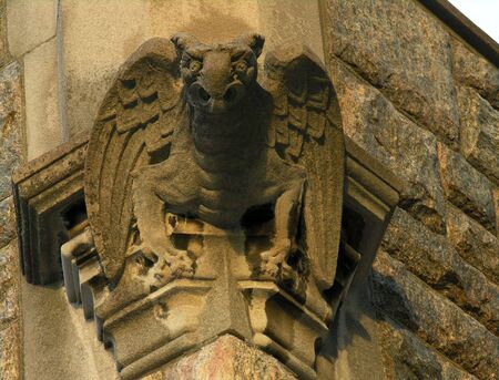 Winged gargoyle on vintage church.の写真素材