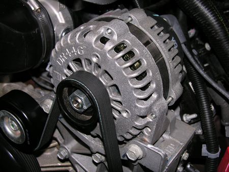  Alternator and drive belt on an automobile.の写真素材