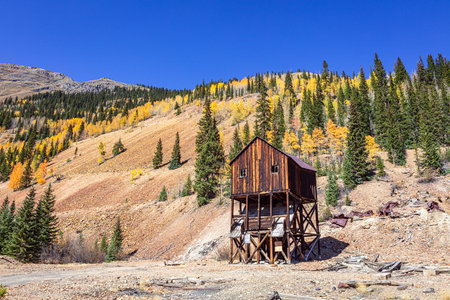 Wooden mining structure in the autumn alpine Rocky Mountain landscape. Colorado, USA.の写真素材