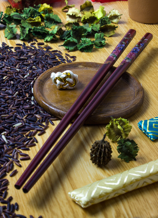 A chopsticks on the green dry flower backgroundの写真素材