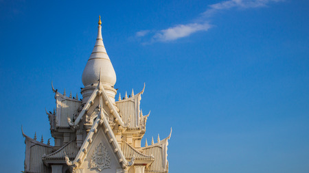 The white thai temple roof on blue sky backgroundの写真素材
