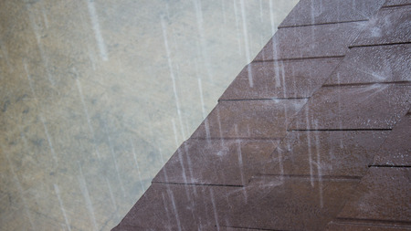 The big raining on the house roof topの写真素材