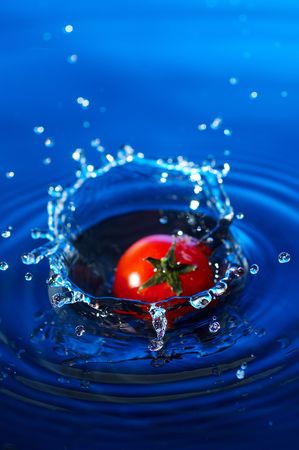 Cherry tomato in waterの写真素材