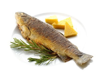 Fried trout with rosemary and corn groats