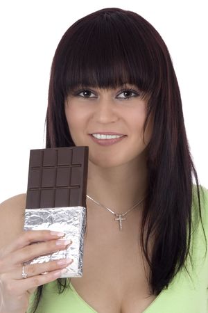 Woman with a chocolate against a white backgroundの写真素材