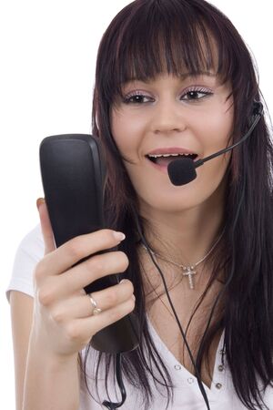 Woman telephonist with hands-free phoneの写真素材