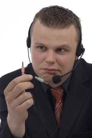 Man telephonist with hands-free phone against a white backgroundの写真素材