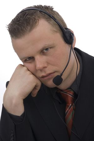 Bored operator against a white background の写真素材