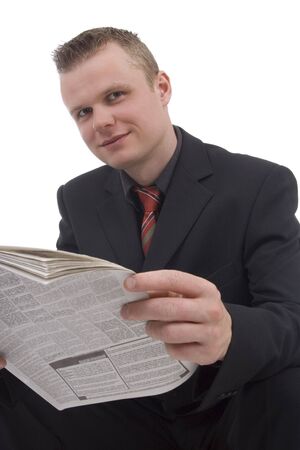 Man with newspaper against a white backgroundの写真素材
