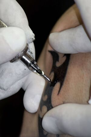 Tattoo on the shoulder black in inkの写真素材