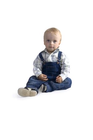 Sitting boy on white backgroundの写真素材