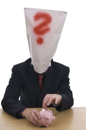 Man with moneybox and sack  on head whereat is red question - mark. の写真素材
