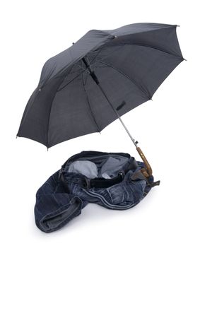 Toss jeans with umbrella on white background.の写真素材