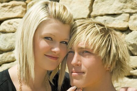 Beautiful woman and man.Background stone - wall.の写真素材