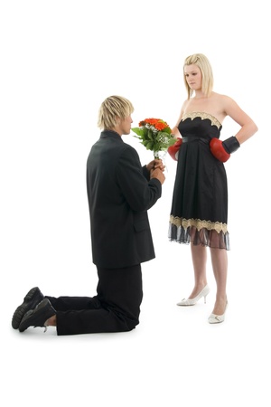 Man suppliant woman about forgiveness on white background.の写真素材
