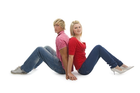 Man and woman sitting on white background.の写真素材