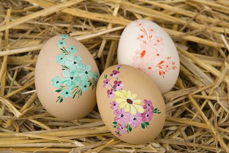 Easter egg against a background from straw.の写真素材