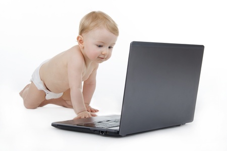 Child with laptop,on white background.の写真素材