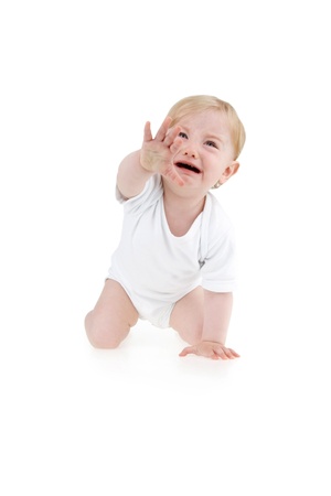 Crying suckling crawler on all fours on white background.の写真素材