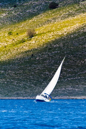 Sailing in the Adriatic sea during cold summerの写真素材