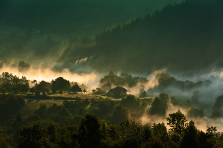 Morning in mountains with fog and clouds during sunriseのeditorial素材