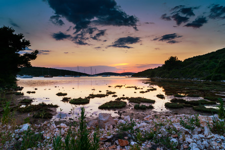 Sunset over an island bay in Dalmatia, Croatiaの写真素材