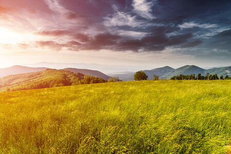 Morning in mountains with Sun rising rural sceneryの写真素材