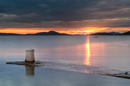 Sunset over an island bay in Dalmatia, Croatiaの写真素材