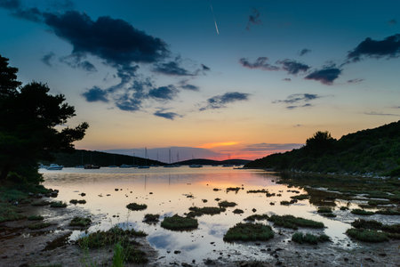 Sunset over an island bay in Dalmatia, Croatiaの写真素材