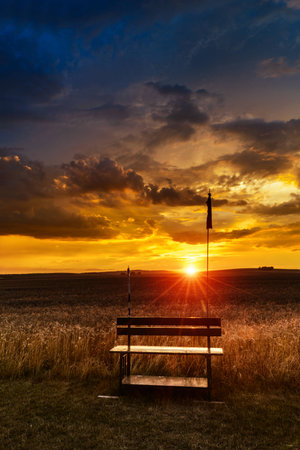 Sunset in fields in Central Europe with heavy cloudsの写真素材