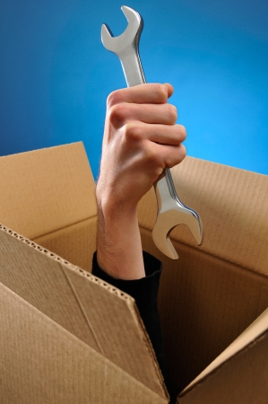 Delivering a Hand Holding Spannerの写真素材