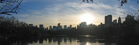 Sunset on the city from central park above the lake - New York.の写真素材