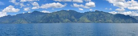 Lake with volcanos in the background - Lake Atitlan - Guatemala - Panorama.の写真素材