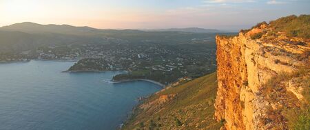Wild red rocks of the cliff of Canaille cap and Cassis city behind - Marseille - South of France - Panorama.の写真素材