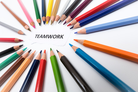 Pointer of many colored pencils arranged in circle on the word idea and white backgroundの写真素材