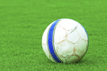 Soccer ball, green lawn.の写真素材