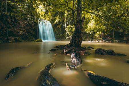 Waterfall in forest at Erawan waterfall National Park, Kanchanaburi, Thailandの写真素材