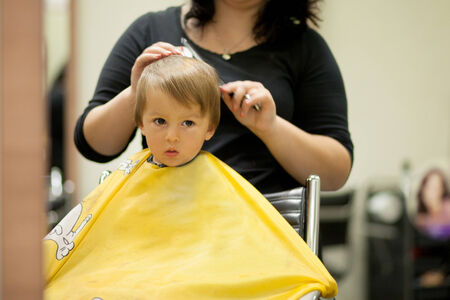 Boy, having haircut の写真素材