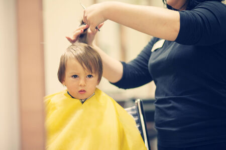 Boy, having haircut の写真素材