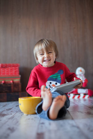 Little boy, playing on tablet の写真素材