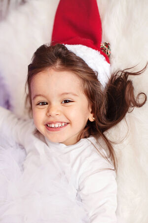 Little girl with christmas hat の写真素材